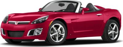 Red convertible roadster with aerodynamic body and alloy wheels
