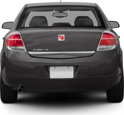 Rear view of a sedan with distinctive taillights and a single exhaust pipe.