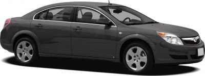 Side profile of a sedan with alloy wheels and four doors.