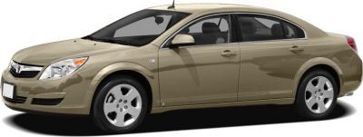 Beige mid-size sedan side profile with four doors and alloy wheels