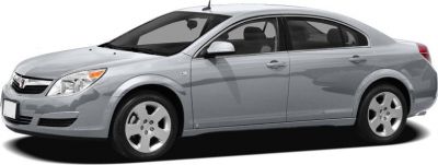 Silver four-door sedan with alloy wheels and sleek body lines.