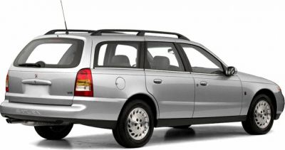 Silver station wagon rear side view with roof rails and classic 2000 design