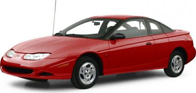Red two-door coupe in a front-side view with aerodynamic design.