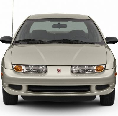 Front view with dual headlights and compact sedan design