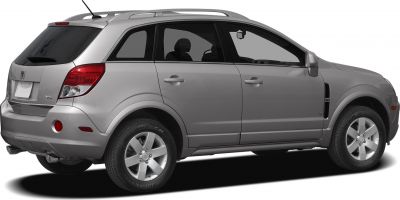 Rear side profile showing alloy wheels, roof rails, and rear taillights
