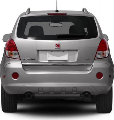 Rear view of SUV with V6 badge, dual exhaust, and tail lights