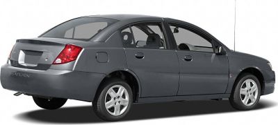 Rear and side profile of gray sedan with distinctive tail lamps