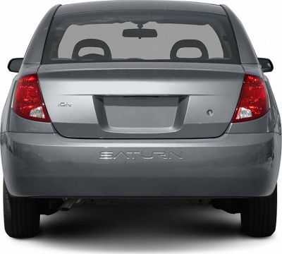 Rear view showing tail lights, hatchback trunk, and rear window.