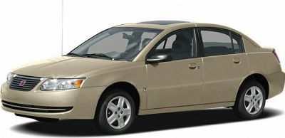 Beige four-door sedan with sunroof and alloy wheels