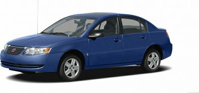 Blue four-door sedan showing front side exterior with alloy wheels