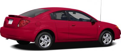 Red two-door coupe with rear spoiler and alloy wheels