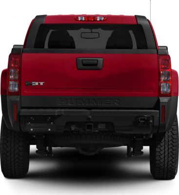 Rear view of rugged pickup truck with bold taillights and large tires