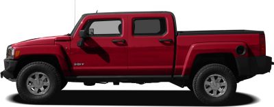 Red heavy duty four-door pickup with off-road tires side profile
