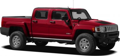 Red pickup truck with off-road tires and chrome grille