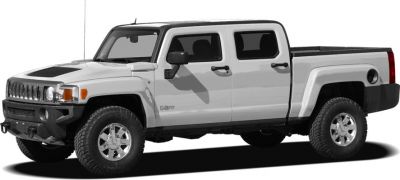 Side profile of a crew cab pickup with off-road tires and rugged design.
