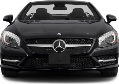 Front view with distinctive grille and headlight design.