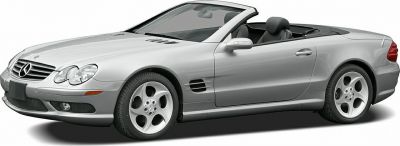 Silver convertible with aerodynamic design and distinct round headlights