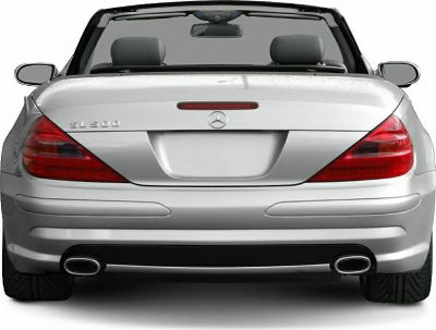 Rear view of convertible with distinctive tail lights and dual exhaust