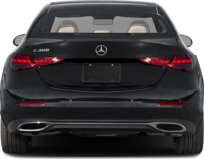 Rear view with sleek taillights and dual exhausts of a sedan.