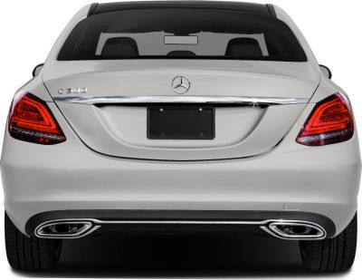 Rear view featuring tail lights, trunk, and dual exhaust outlets.