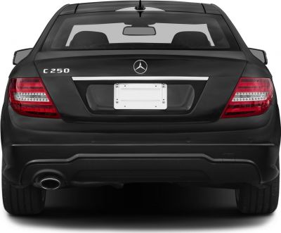 Rear view with LED tail lights and single exhaust of a coupe