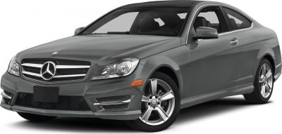 Front-side view highlighting headlamps and grille of a coupe.