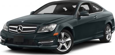 Front-side view of sleek coupe with distinctive grille and alloy wheels