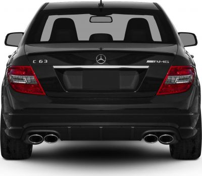 Rear view of a sedan with quad exhaust tips and AMG badge