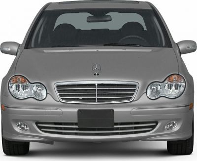 Front view showing headlights, grille, emblem, and bumper of sedan