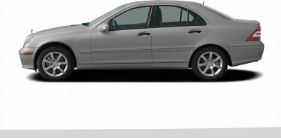Side profile of a sedan with alloy wheels and smooth body lines.