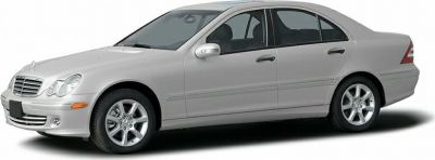 Silver sedan with distinctive round headlights and alloy wheels side profile