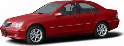 Red sedan with rounded headlights and alloy wheels