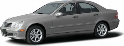 Silver sedan side profile with alloy wheels and chrome-trim grill