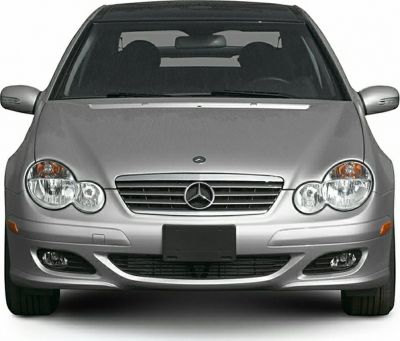 Front view with distinctive headlights and grille