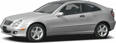 Side profile of a sleek silver sport coupe with alloy wheels.