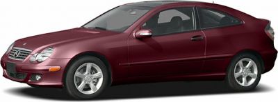 Side profile of a two-door coupe with alloy wheels