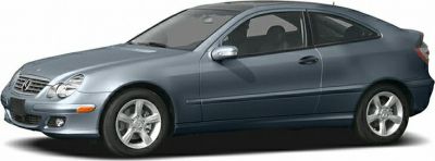 Side view of a two-door luxury coupe with alloy wheels