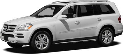 Side profile of a silver luxury full-size SUV with alloy wheels and roof rails