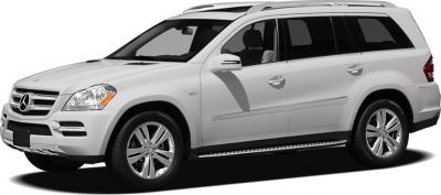 Silver luxury SUV with alloy wheels and roof rails side profile