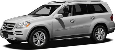 Silver full-size SUV side view with roof rails and alloy wheels