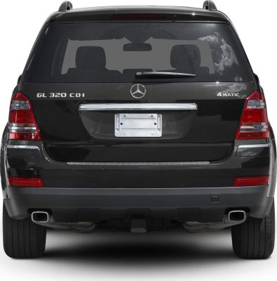 Rear view showing GL 320 CDI and 4MATIC badges, dual exhaust, and taillights.