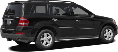 Rear side view of black mid-2000s SUV with chrome trim and alloy wheels