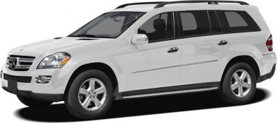 Front-side view of a white luxury SUV with alloy wheels