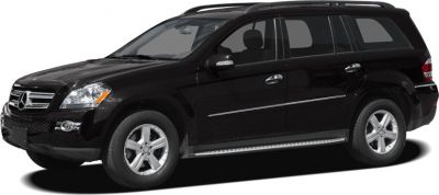 Side profile of a black SUV with alloy wheels and roof rails