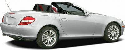 Convertible car rear side with silver body and red seats