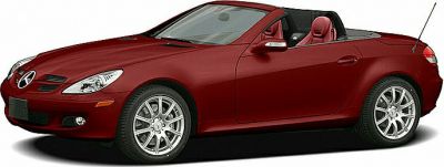 Red convertible sports car with alloy wheels and two seats