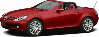 Convertible red two-seater roadster with retractable hardtop and sporty design