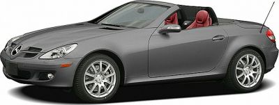 Silver convertible with red interior and sleek aerodynamic design