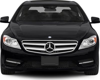 Front view with iconic grille and sharp headlights