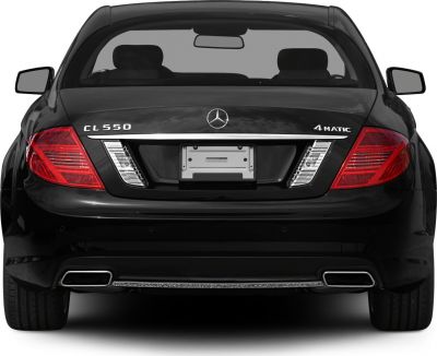 Rear view of a luxury coupe with distinct taillights and dual exhaust outlets